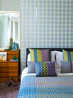 Patterned soft furnishings on bed
