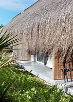 Beach house with thatched roof
