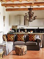 Grey sofa with orange cushions