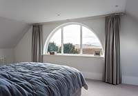 Arched window in bedroom