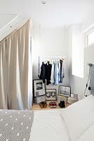 Clothes rail in bedroom corner