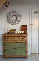 Christmas decorations on wooden cupboard