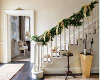 Christmas garland wrapped around bannisters