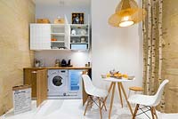 Integrated appliances in open plan kitchen
