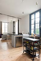 Modern open plan kitchen with wooden floors