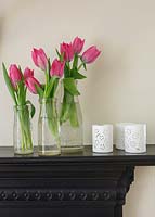 Bottles of Tulips on mantlepiece