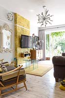 Colourful living room with modern and vintage furniture