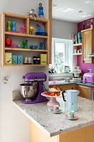 Colourful kitchen accessories on granite worktop