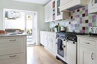 Country kitchen with colourful tiling