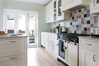 Country kitchen with colourful tiling