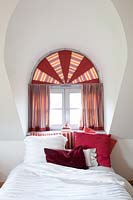 Arched window with curtains