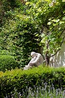 Formal garden with sculpture