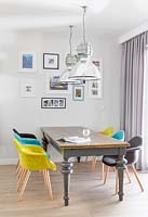 Open plan dining area with colourful chairs