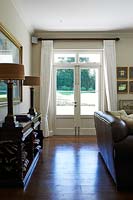 Patio doors with white curtains