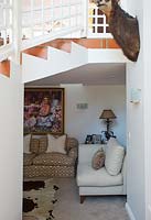 Compact seating area under stairs