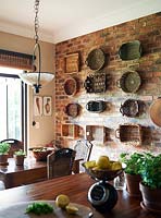 Display of baskets on kitchen wall