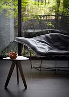 Chaise longue by window