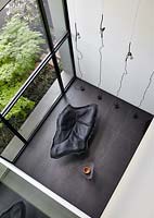 Chaise longue by window