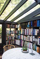 Conservatory with bookshelves