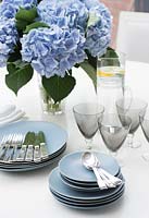 Blue crockery on dining table