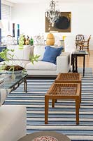 Wooden stools on striped rug