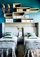 Storage above beds in childs room