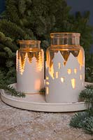 Clay Lanterns - glass jars wrapped with a textured clay cityscape 