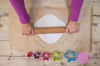 Making clay stars - Use a rolling pin to stretch out the modelling clay