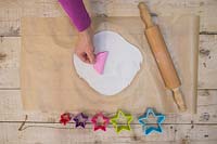 Making clay stars - Create multiple pattern impressions on the modelling clay using the silicone mould