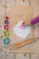 Making clay stars - Create multiple pattern impressions on the modelling clay using the silicone mould