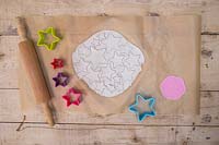 Making clay stars - a variety of different sized stars cut out from the modelling clay 