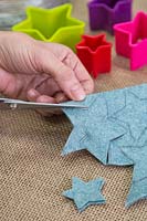 Making a felt christmas tree - Cut out the stars following the pencil guideline