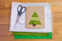 Making felt christmas tree cards - Materials required are a needle, thread, net fabric, coloured felt and a pair of scissors