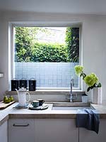 Kitchen window with decorative film