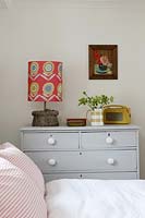 Patterned lamp on chest of drawers