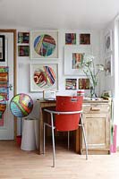 Desk with colourful art display
