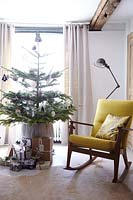Rocking chair by christmas tree