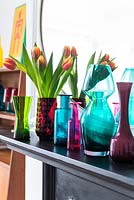 Vases of Tulip  flowers on mantlepiece