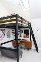Bedroom with sleeping platform and study space
