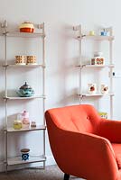 Colourful accessories on white shelves