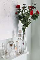 Vase of Roses on mantlepiece