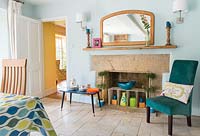 Colourful accessories around fireplace