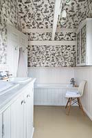 Bathroom with patterned wallpaper