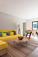 Colourful seating area with games table