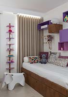 Childs bed with colourful cushions
