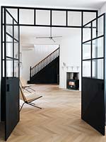 Open plan living space with parquet flooring