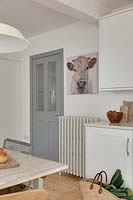 Cow painting on kitchen wall