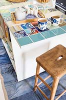 Kitchen island with colourful tiles