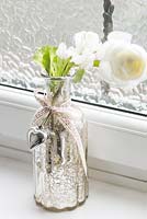 Flowers in silver vase