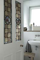 Bathroom door with stained glass panels